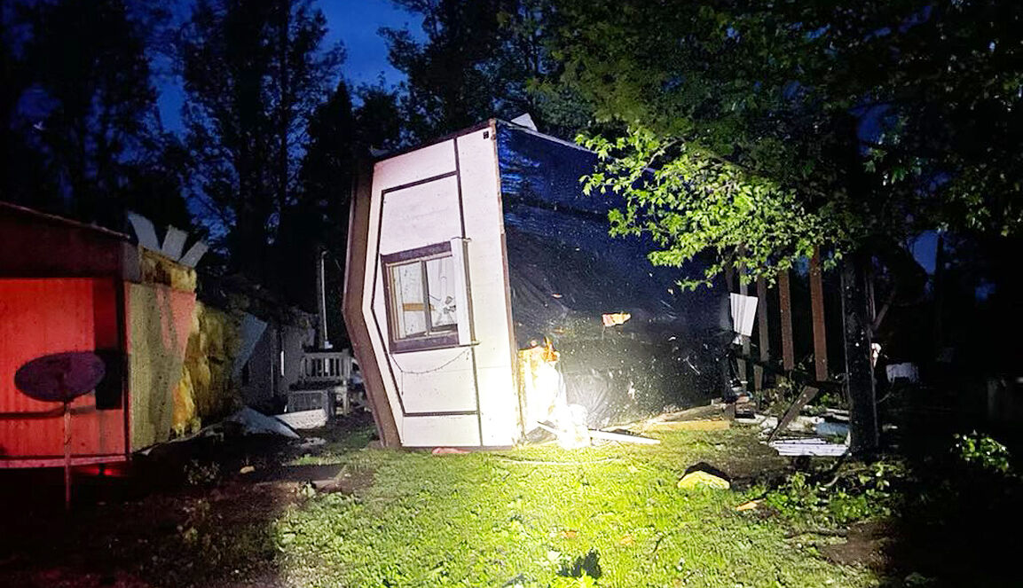 Storms flip home on lake highway